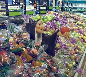 Evil witch offering apples at Albert Heijn